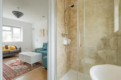 a bathroom with a shower and a sink at Luxury City House - 1 min from river - Parking - Sleeps 10 in Cambridge