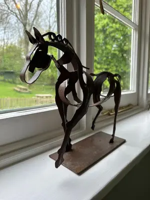 a metal statue of a horse on a window sill at Black Horse in Brent Pelham