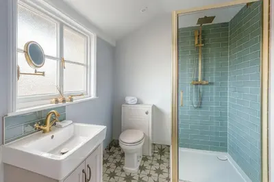 a bathroom with a sink and a toilet and a shower at Black Horse in Brent Pelham