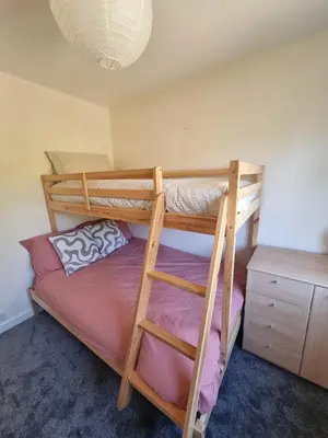 a bedroom with two bunk beds and a desk at Blossom House in Woodbridge