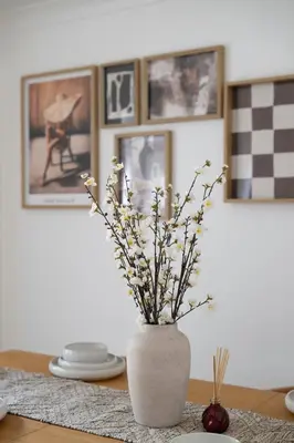 a vase with flowers in it sitting on a table at The Romford Oasis - Spacious 4 bedroom escape in Havering atte Bower