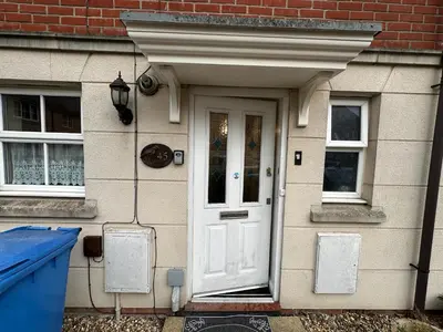 a house with a white door and windows at Cosy En-suite Rooms - Ipswich in Ipswich