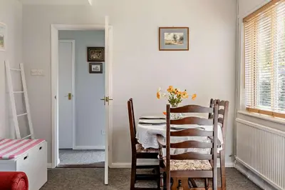 a dining room with a table and chairs at 3 Bed in Bawdsey oc-p31139 in Bawdsey