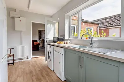 a kitchen with a sink and a dishwasher at 3 Bed in Bawdsey oc-p31139 in Bawdsey