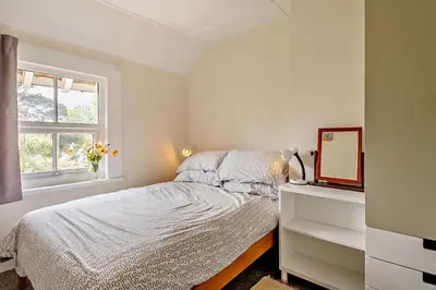 a white bedroom with a bed and a window at 3 Bed in Bawdsey oc-p31139 in Bawdsey