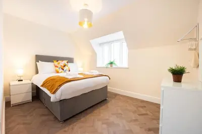 a bedroom with a bed and a window at 8 The Royal Serviced Apartments ,Harwich, One Bed Parking, Fast Wifi, Space Apartments in Parkeston