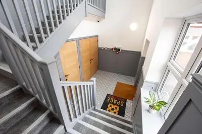 an overhead view of a stairway with a book at 8 The Royal Serviced Apartments ,Harwich, One Bed Parking, Fast Wifi, Space Apartments in Parkeston