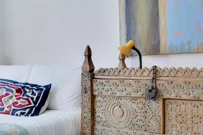 a couch with a lamp on top of it at Pass the Keys Charming Ground Floor Flat with Free Parking in Cambridge