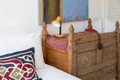 a bedroom with a bed with a lamp on it at Pass the Keys Charming Ground Floor Flat with Free Parking in Cambridge