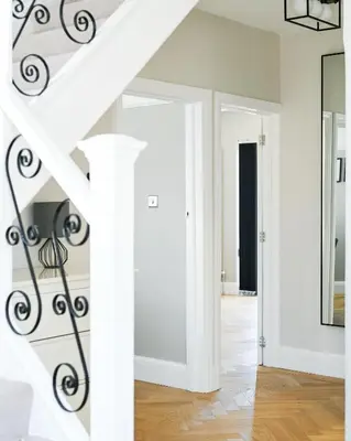 a staircase in a living room with white walls at Relaxing home Leigh on Sea in Southend-on-Sea