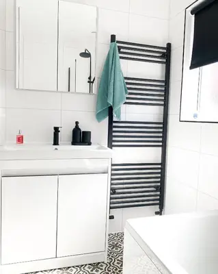 a white bathroom with a sink and a towel at Relaxing home Leigh on Sea in Southend-on-Sea