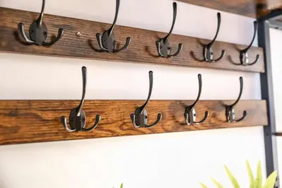 a bunch of hooks hanging on a wall at Modern Spacious 4 Bedroom 3 Bathroom House by Trinity Stays Short Term Lets & Serviced Accommodation Cambridge in Cambridge