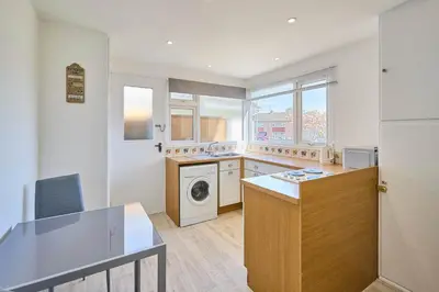 a kitchen with a washer and dryer at Host & Stay - Park View in Thetford