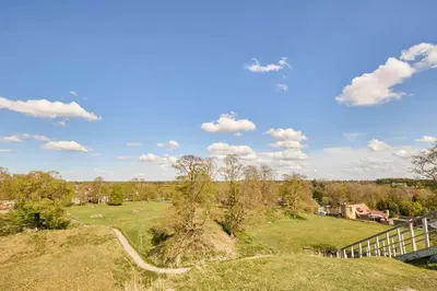 a view of a field with a fence and a road at Host & Stay - Park View in Thetford