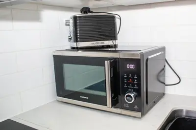 a microwave sitting on top of a kitchen counter at Promenade Apartment in Maldon