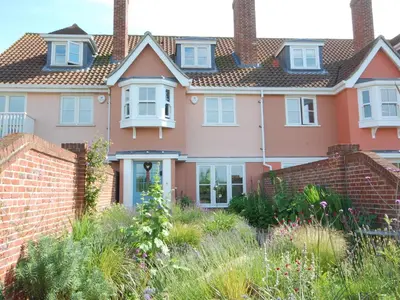 a house with a garden in front of it at Sea Crest in Aldeburgh