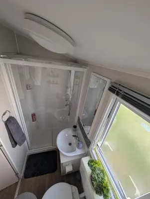 a small bathroom with a toilet and a sink at LuKa25 GC080 in Saint Osyth