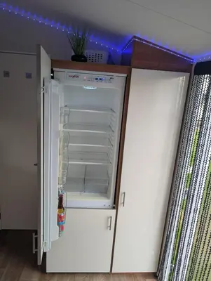 a white refrigerator with its door open in a room at LuKa25 GC080 in Saint Osyth