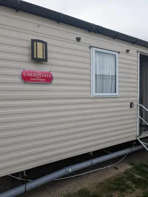 a building with a sign on the side of it at LuKa25 GC080 in Saint Osyth