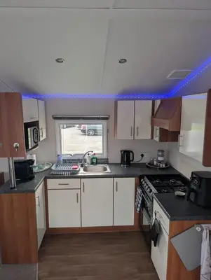 a kitchen with a sink and a stove top oven at LuKa25 GC080 in Saint Osyth