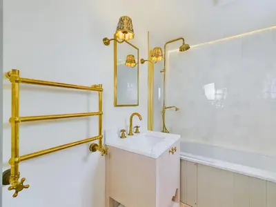 a bathroom with a sink and a bath tub at Stunning Heritage Cottage- The Heart of Old Leigh in Southend-on-Sea