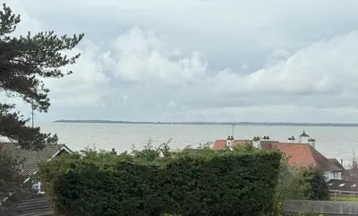 a view of a large body of water with houses at Lighthouse Lodge in Harwich