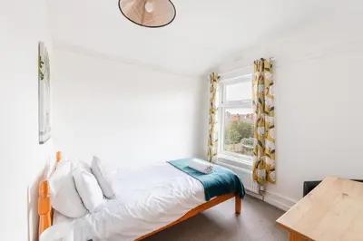 a bedroom with a bed and a window at Modern bedrooms-Family -Free Parking-Hi-Speed WiFi-Sleeps 5 in Colchester