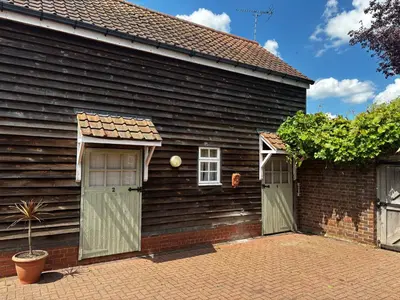 a house with two doors on the side of it at Thaxted Bed & Breakfast and Accommodation in Thaxted