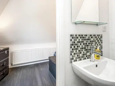 a bathroom with a sink and a mirror at Treetops - Uk49523 in Saint Lawrence