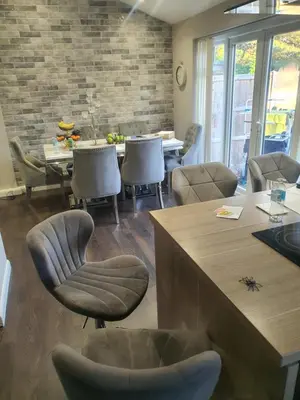 a dining room with a table and chairs and a table and chairsktop at One bed room in three bed room house in Hoddesdon