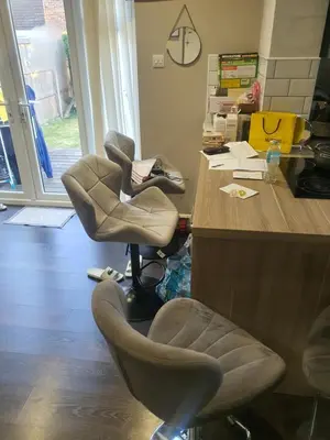 an office with two chairs next to a desk at One bed room in three bed room house in Hoddesdon