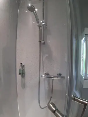 a shower with a glass door in a bathroom at All Manor Of Events - Glamping Pods in Henley