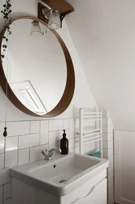 a bathroom with a sink and a mirror at The Avenue in Cherry Hinton