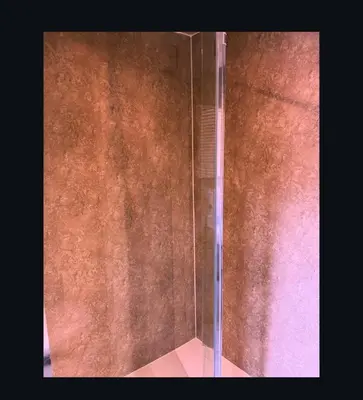 a shower with a glass door in a bathroom at Upstairs at Rumblebees in Felsted Station