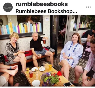 a group of people sitting around a table at Upstairs at Rumblebees in Felsted Station