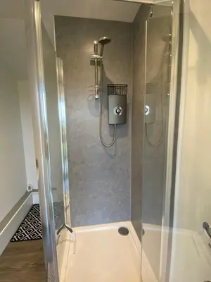 a shower with a glass door in a bathroom at The Skye Yurt in Messing