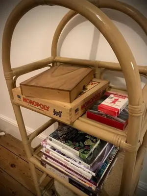a basket full of books on a table at Homely flat just off Leigh Broadway in Southend-on-Sea
