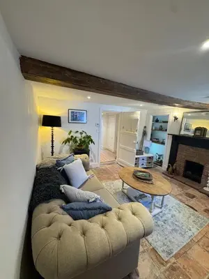 a living room with a couch and a table at 5 chapel lane Wymondham Norfolk in Wymondham
