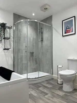 a bathroom with a shower and a toilet at 5 Bed Home near Anglesey Abbey in Swaffham Bulbeck