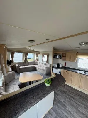 a kitchen and living room in an rv at Santos Caravan Beautiful Holiday Home in Clacton-on-Sea