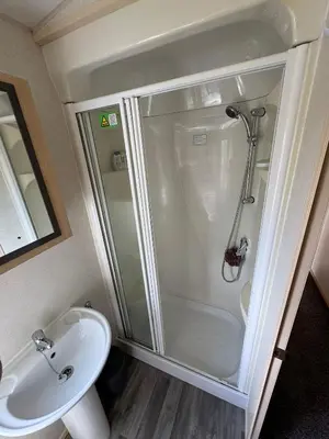 a bathroom with a shower and a sink at Santos Caravan Beautiful Holiday Home in Clacton-on-Sea