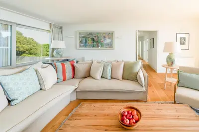 a living room with a couch and a table at Heath House 4 in Thorpeness