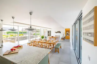 a kitchen and dining room with a table and chairs at Heath House in Thorpeness