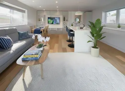 a living room with a couch and a table at Modern stylish house in Charming Fen Ditton Village in CBG