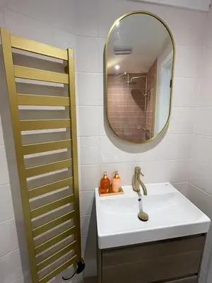 a bathroom with a sink and a mirror at Very best location - Luxury boutique apartment by river and historic city centre in Cambridge
