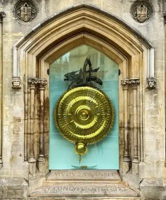 a large gold object in a glass window on a building at Very best location - Luxury Studio by river and historic city centre in Cambridge