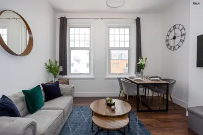 a living room with a couch and a table at 1 Bed Apartments, 2 Mins to Beach, Sleeps 4 in Southend-on-Sea