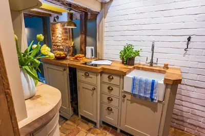 a kitchen with a sink and a counter at Cosy & charming medieval 'Bumble Cottage' in Kersey