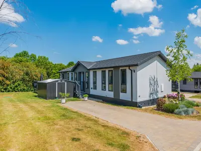 a modular home with a driveway at Sunnyfields in Cambridge