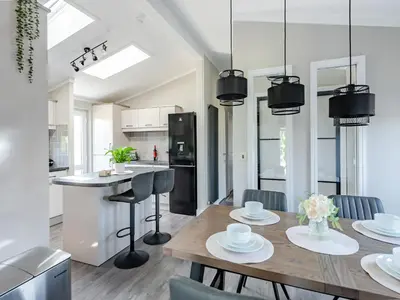 a kitchen and dining room with a table and chairs at Sunnyfields in Cambridge